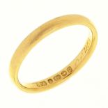 A 22ct gold wedding ring, Birmingham 1989, 11.2g, size K½ Wear consistent with age