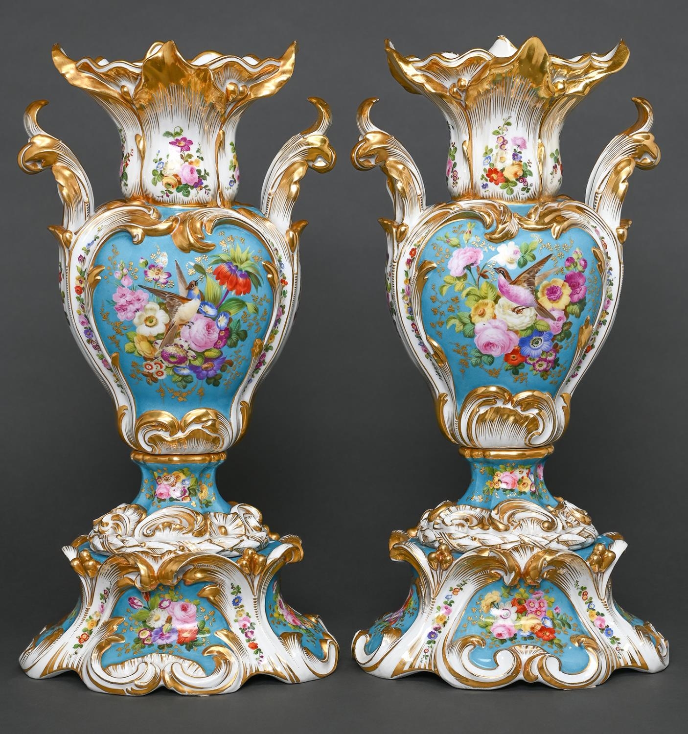 A pair of French revived rococo vases, c1850, painted with birds and flowers reserved on a bleu