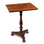 A George IV rosewood lamp table, the oblong top on baluster pillar, platform and lobed bun feet with