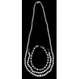 A cultured pearl necklace, of 3-7mm cultured pearls, gold clasp marked 14K, 51cm l and two similar
