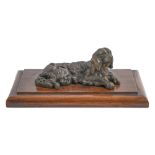 A bronze inkwell in the form of a recumbent spaniel, 19th / early 20th c, 14cm l, mounted on