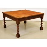 HMS "Foudroyant".  An oak dining table,  the square top above a carved frieze of palmettes and