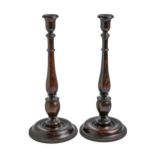 A pair of turned and stained oak baluster candlesticks, early 20th c,  36cm h Good condition