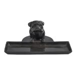 A bronze desk tray set with a seated bulldog, 20th c, dark brown patina rubbed in places, 20cm l