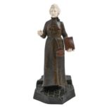 Dambros. A bronze and ivory statuette of a female newspaper seller, early 20th c, on paved base,