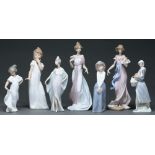 Four Lladro figures of young women and three similar Nao figures, 31cm h and smaller, printed