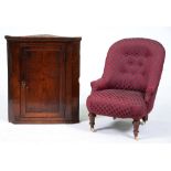 A Victorian nursing chair, on turned walnut legs and a 19th c oak hanging corner cupboard with