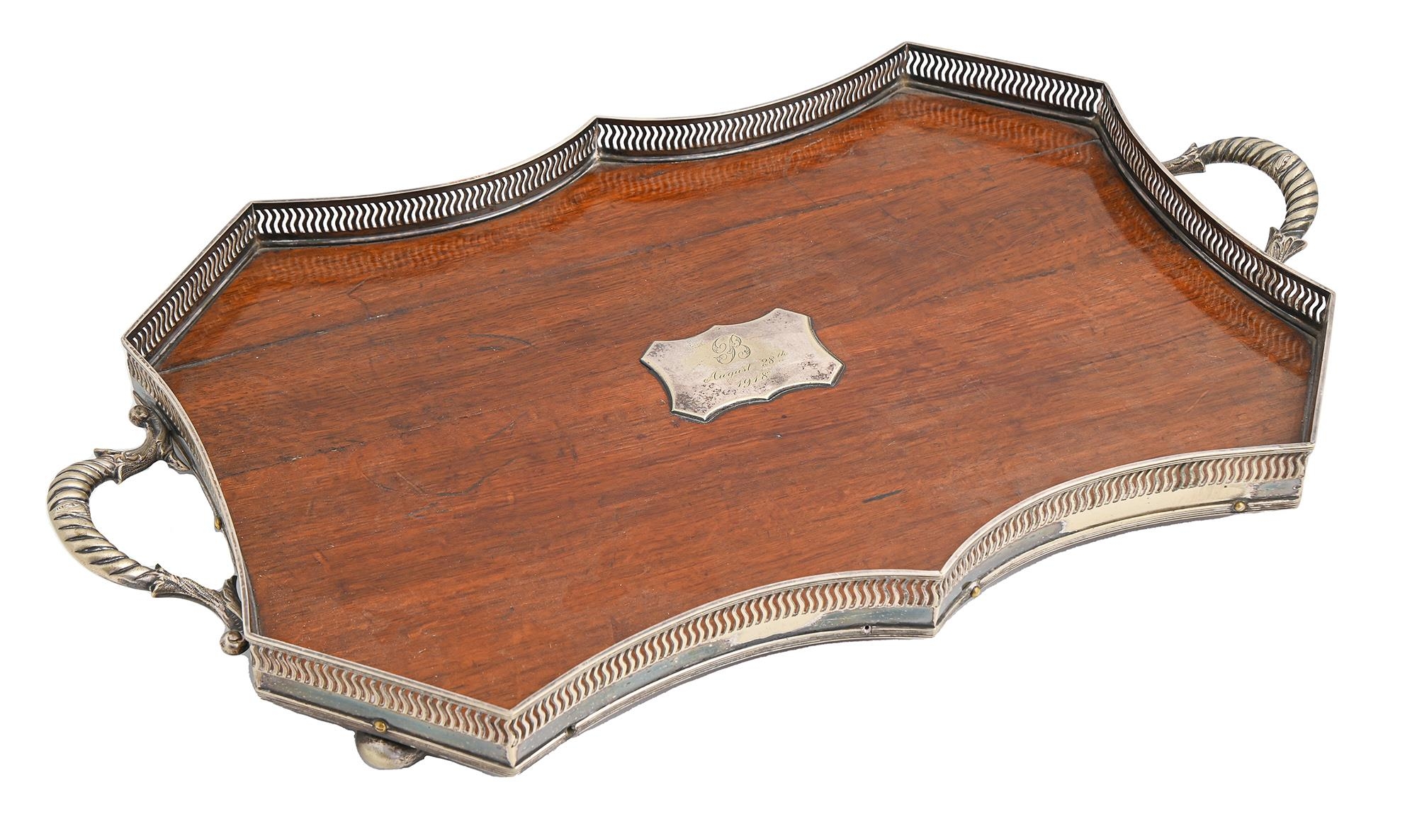 An EPNS mounted oak gallery tray, c1918, on bun feet, 60.5cm over handles Horizontal shrinkage crack
