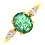 An emerald and diamond ring, the larger oval emerald flanked by navette diamonds, in gold, unmarked,