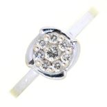 An eight stone diamond cluster ring, in white gold marked 750, 2.5g, size M½