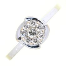 An eight stone diamond cluster ring, in white gold marked 750, 2.5g, size M½