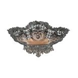 A Victorian silver sweetmeat dish, stamped with leafy scrolls over open trellis, on cast openwork