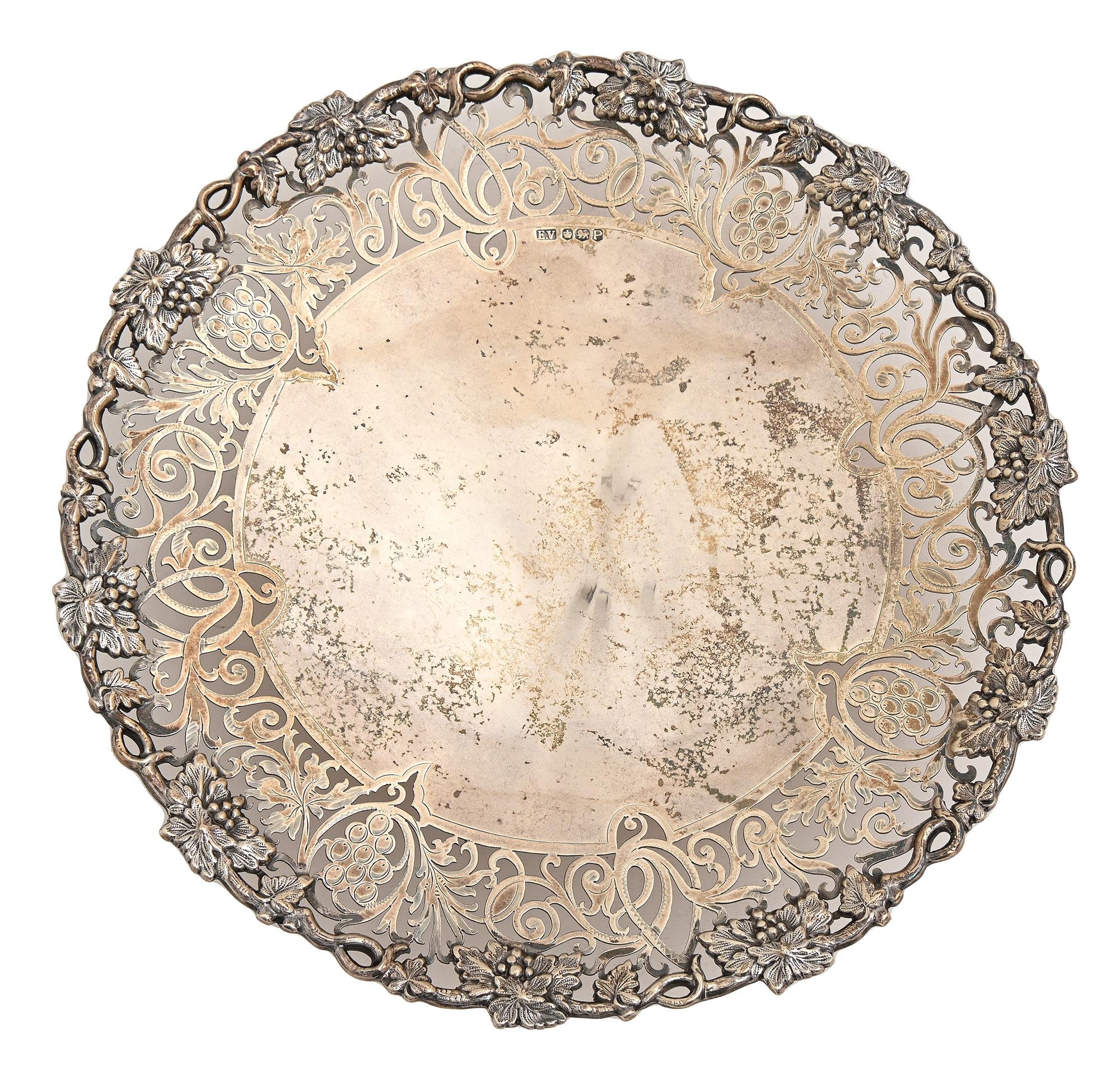 An Elizabeth II saw pierced silver stand, with applied grapevine border, on domed foot, 27cm diam, - Image 2 of 2