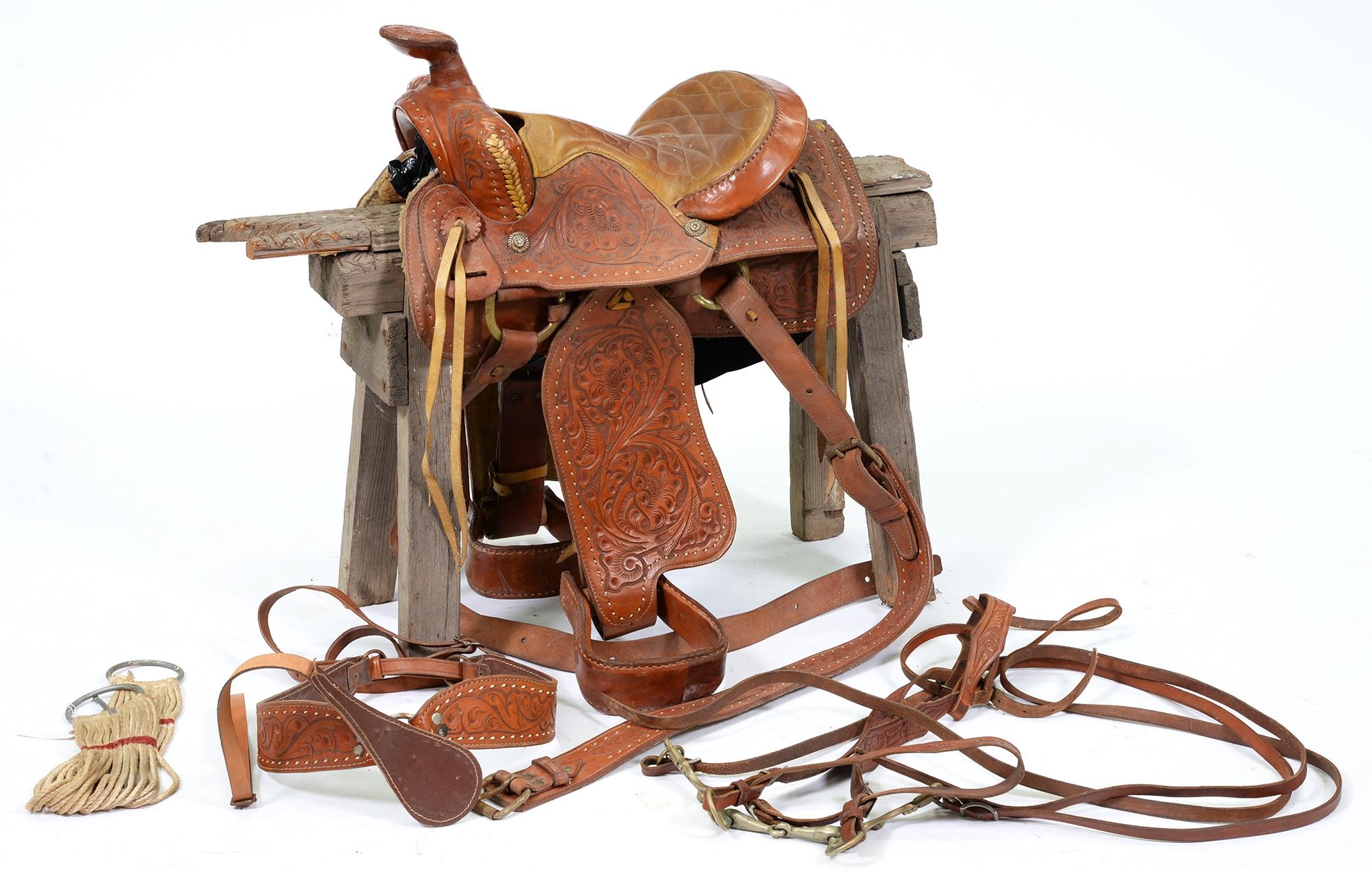 An American saddle, oval stamped mark W.S.M. Buffalo Saddle Co, on wood stand