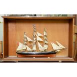 Model ship. A three masted barque, with sails and rigging, 110cm l, in an associated wooden