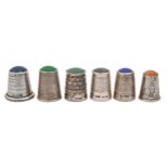 Six English and Continental silver stone topped thimbles, late 19th c and later, various sizes,