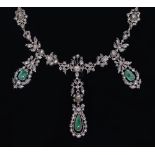 A rose diamond and emerald necklace, 19th c, with round and tear shaped emerald drops in silver,