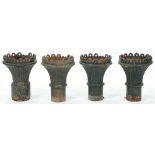 A set of four Victorian cast iron garden vases, of flared, fluted shape with pierced rim, 44cm h
