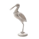 A Continental stork novelty lighter, with red glass bead eyes, the head forming the cover, on