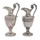 A pair of Continental miniature silver ewers, 19th c, of shield shape, the handle terminating in the