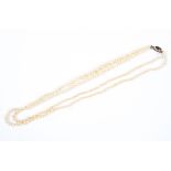 A Continental double strand of graduating synthetic pearls,