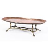 An Arts and Crafts WAS Benson copper and brass footed warming tray, of shaped oval form,