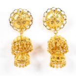 A pair of 20th century unmarked yellow metal chandelier earrings of pierced and wire work design,