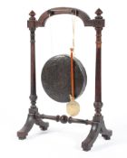 An Edwardian oak framed dinner gong,
