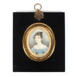 An early 19th century portrait miniature of a lady in blue silk dress, watercolour on ivory,