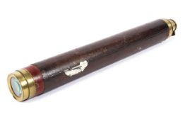 A late 19th century brass single drawer telescope, the outer case bound in leather,