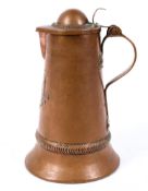 A copper lidded pitcher, with moulded decoration of a scene of a castle,