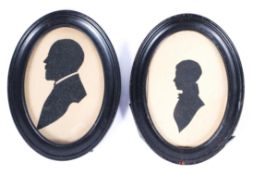 Two Victorian portrait silhouettes, each looking to the left, one a bearded gentleman,