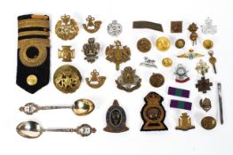 A collection of military badges and related ephemera,