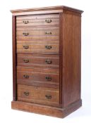 An Edwardian oak Wellington chest,