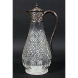 An Edwardian silver mounted cut glass claret jug,