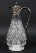 An Edwardian silver mounted cut glass claret jug,