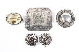 A collection of white metal and silver items to include a circular mourning brooch,