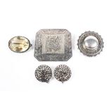 A collection of white metal and silver items to include a circular mourning brooch,