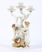 A Royal Worcester three light figural candleabra modelled by James Hadley, late 19th century,