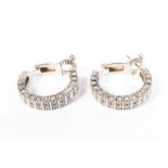 A pair of Boucheron Paris 18ct white gold and diamond hoop earrings,