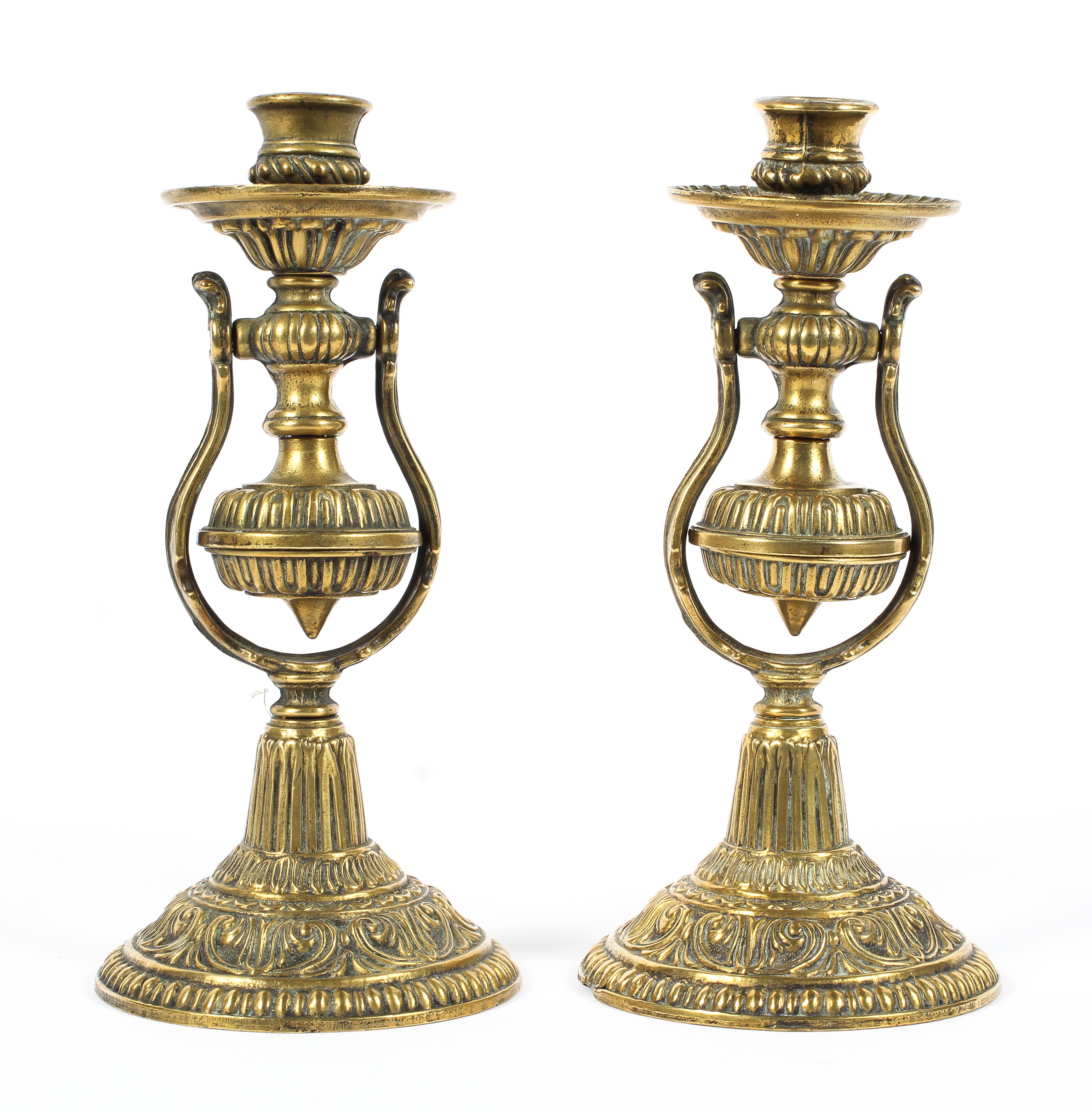 A pair of 20th century brass ships gimble candlesticks,