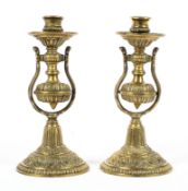 A pair of 20th century brass ships gimble candlesticks,