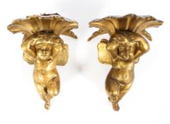 A pair of giltwood cherub wall sconces, early 20th century,
