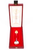 A sterling silver and gilt silver Elizabeth II Silver Jubilee commemorative spoon in red fitted box.