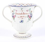 A Staffordshire pearlware named and dated loving cup,