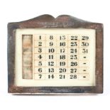 A George V silver mounted desk calendar of rectangular form,