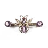 A late 19th/early 20th century unmarked white metal amethyst and seed pearl set brooch