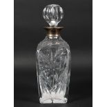 A mid century silver mounted glass decanter, the cut glass body decorated with floral sprays,