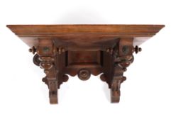 A Victorian mahogany clock wall bracket, with inverted turned baluster ornament and roundels,