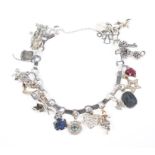 A Boucheron Paris (unmarked) white metal charm bracelet,